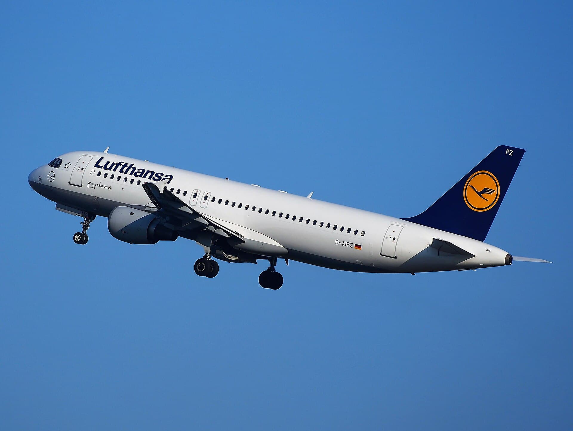 An Airbus A320 airliner lifting off a runway with its landing gear still extended.